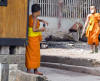 Young monks in training.  With Digital Camera and bubble gum.  Kids will be kids.